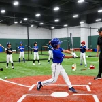 Young athletes training at Hitclub indoor baseball facility.